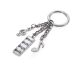 Keyring with 3 charms, musical note, clef, symphony